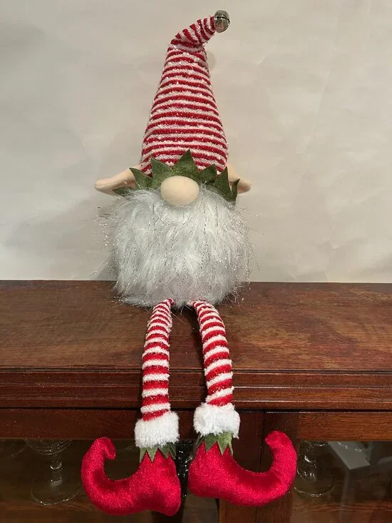 Christmas Holiday Gnome with red and white striped cap and wispy, sparkly white