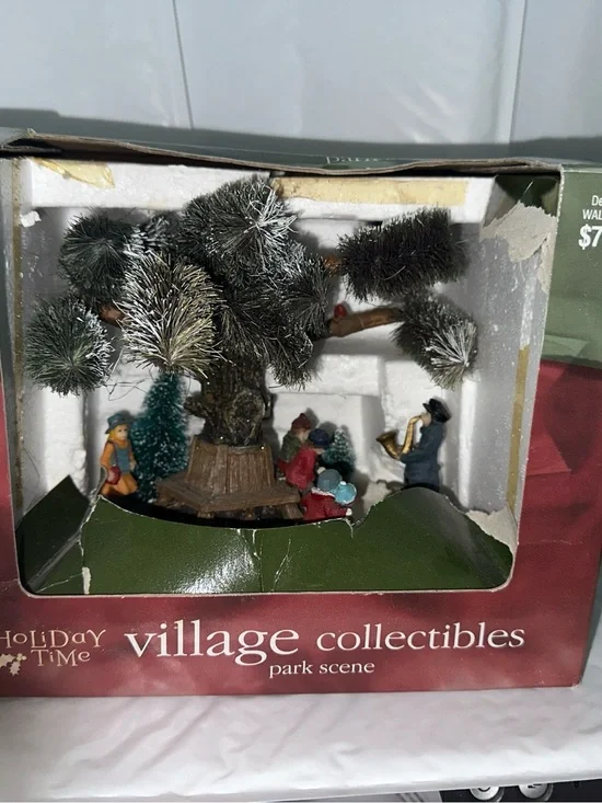 Holiday Time Park Scene with Green Snow-Flocked Tree and Multicolor Figures