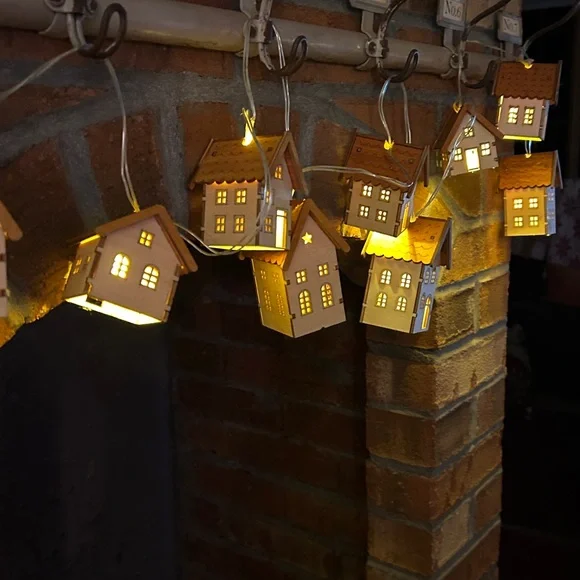 2 sets of tiny House garland with battery operated lights inside. 10 ft cord.