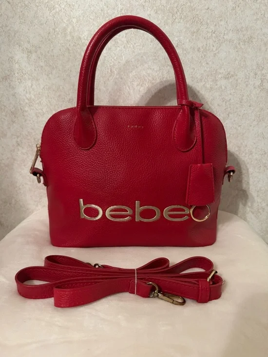 bebe Red Pebbled Fabiola Leather Satchel with Gold Logo Accent with strap.