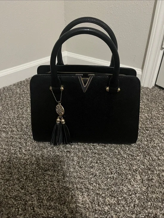 Structured Black Top-Handle Satchel with Tassel Charm