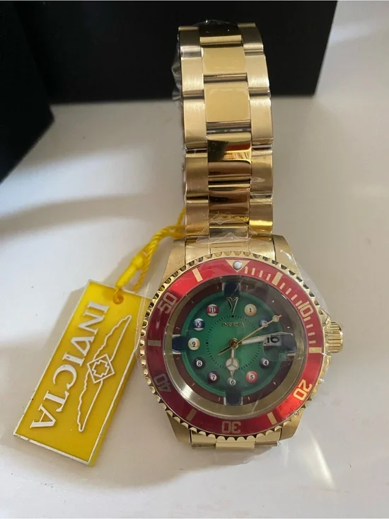 Invicta Gold Watch with Green Dial and Red Bezel