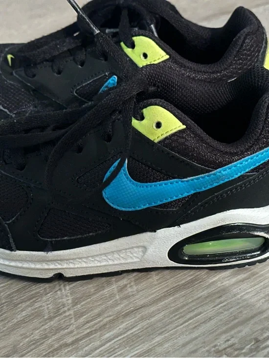 Nike Kids Black Sneakers with Blue Swoosh and Neon Yellow Accents