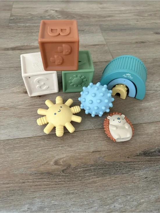 Itzy Ritzy Sensory Stack & Squeeze Toy Set - Cream, Green, Blue, Yellow, Tan