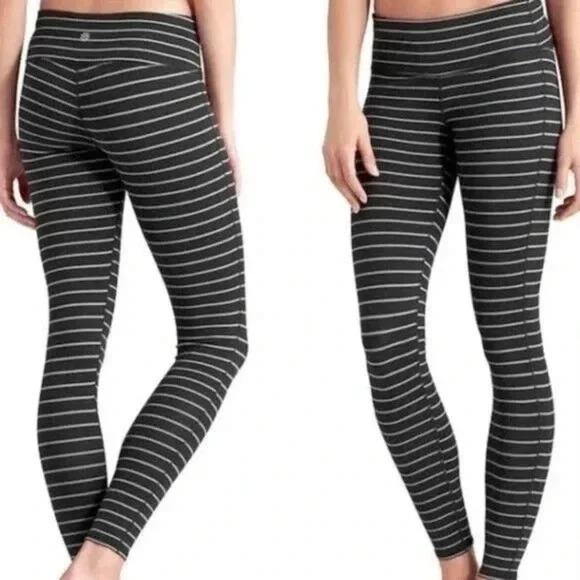 Athleta Chaturanga tight leggings in a black and gray striped pattern