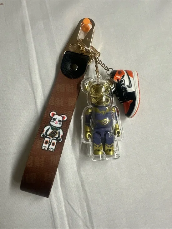 Gold & Purple Bear Keychain with Orange-Black Sneaker Charm