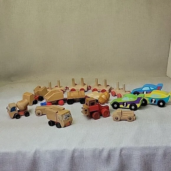 Assorted small wood‎ vehicles..train, dumo truck, race cars...