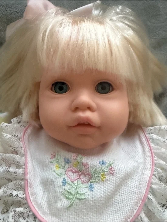 Doll by Pauline Blonde Vinyl Baby Doll with Embroidered Bib