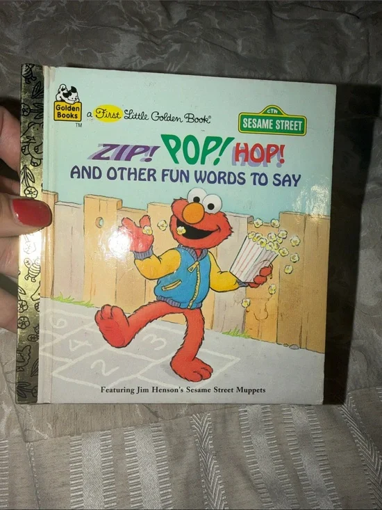 Sesame Street Zip! Pop! Hop! Elmo Board Book - Blue & Red