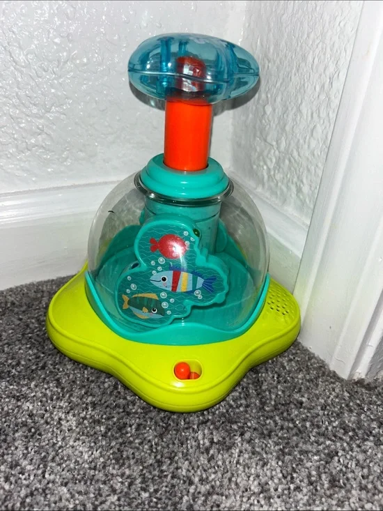 Bright Starts- Press & Glow Spinner Toy