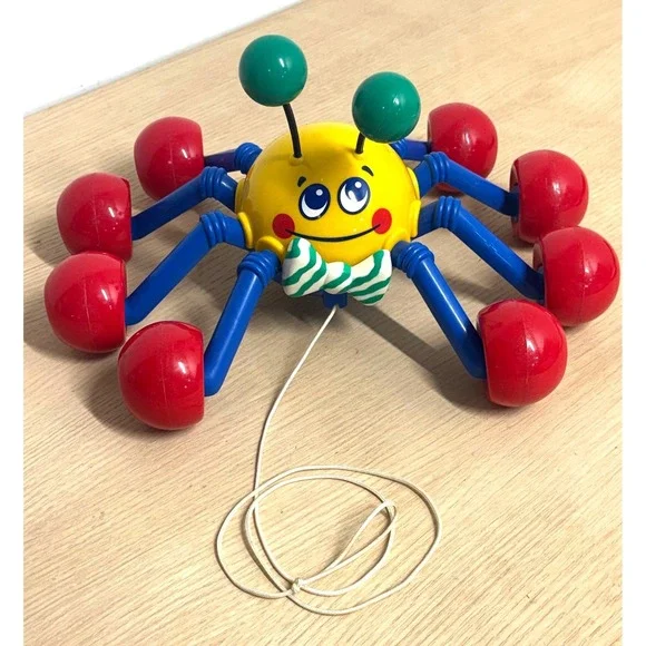 Vintage 1999 Tomy Pull Along Spider Toy Yellow Blue Red Rolling Wheels Bow Tie