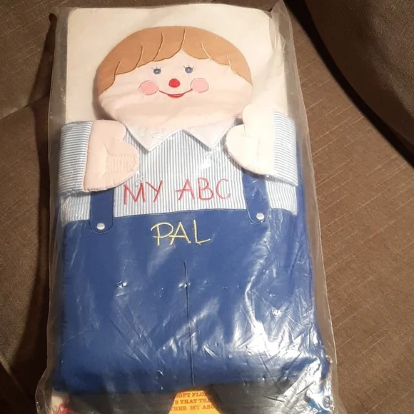 Soft sided zippered carry bag. Big soft floppy doll filled with ABC pill…