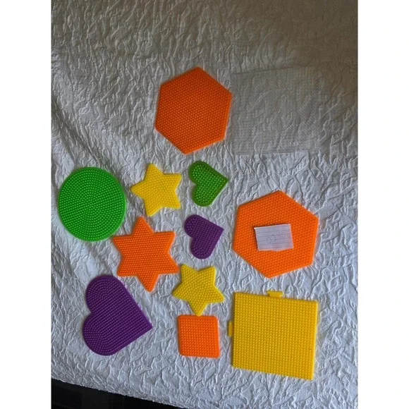 Lot B Perler bead pegboards in various shapes and bright colors