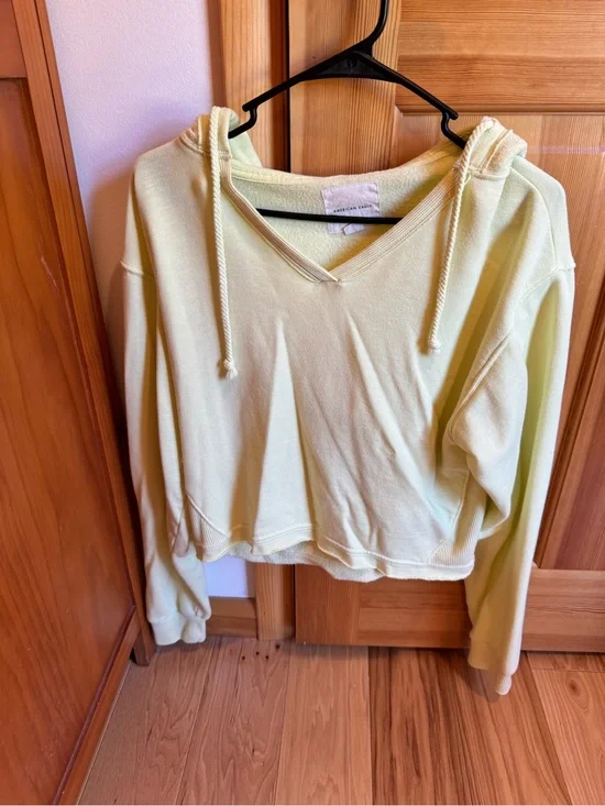 American Eagle Outfitters V-Neck Cropped Hoodie in Pale Yellow