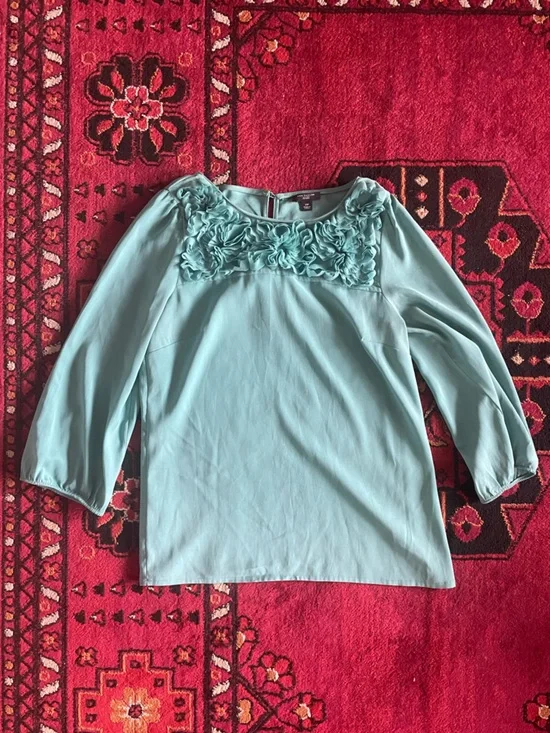 Ann Taylor turquoise blouse with flower ruffles