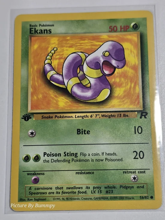 #13 Pokemon 1st Edition Ekans card from the 2000 Team Rocket expansion, #56/82.