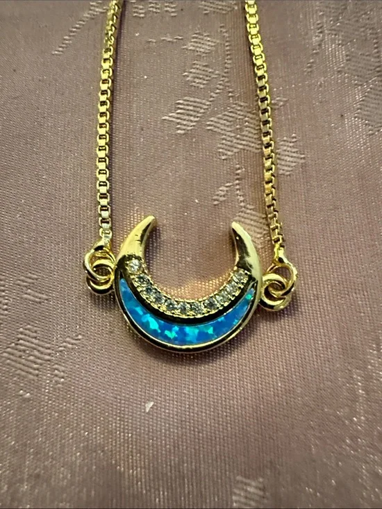 Gold Crescent bracelet with Blue Opal and Crystal Accents