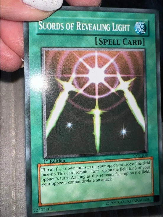 Yu-Gi-Oh! 1st Edition Super Rare Suords  swords of Revealing Light misspelling