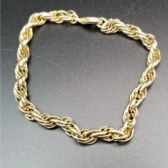 Cable chain gold tone twist golden age bracelet. B329