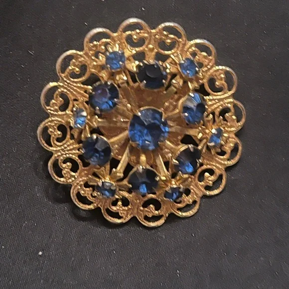 Vintage Gold Tone Circle Brooch with Deep Blue Rhinestones