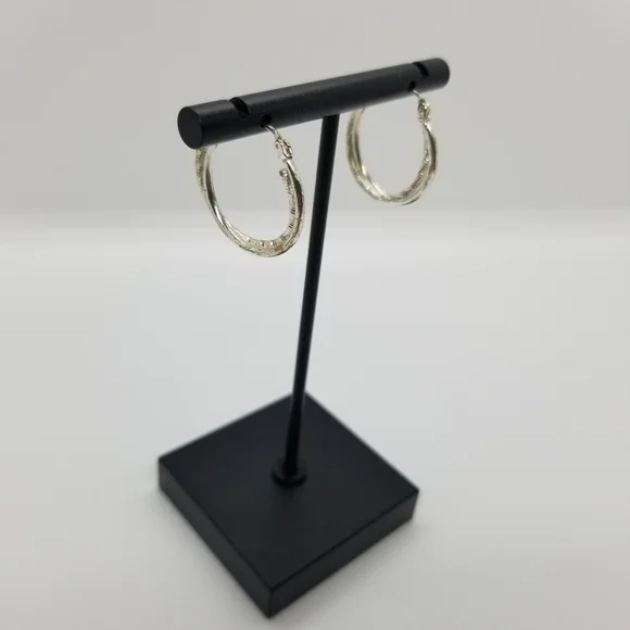 silver tone textured twist hoop earrings