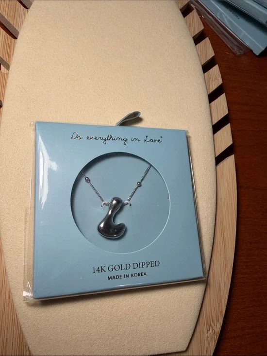 Do everything in Love Silver-tone Abstract Pendant Necklace