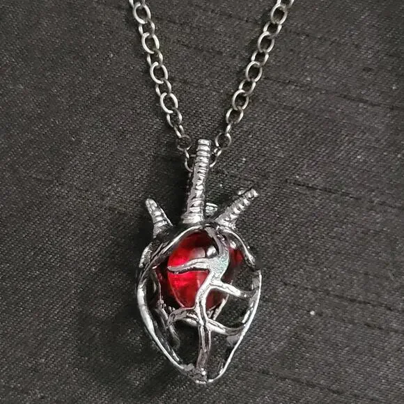 Red & black anatomical heart cage with crystal necklace