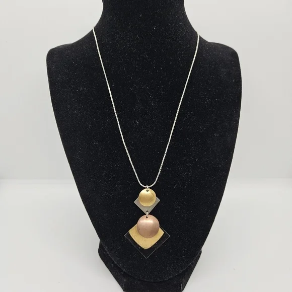 silver tone chain necklace with multi-tone geometric pendant