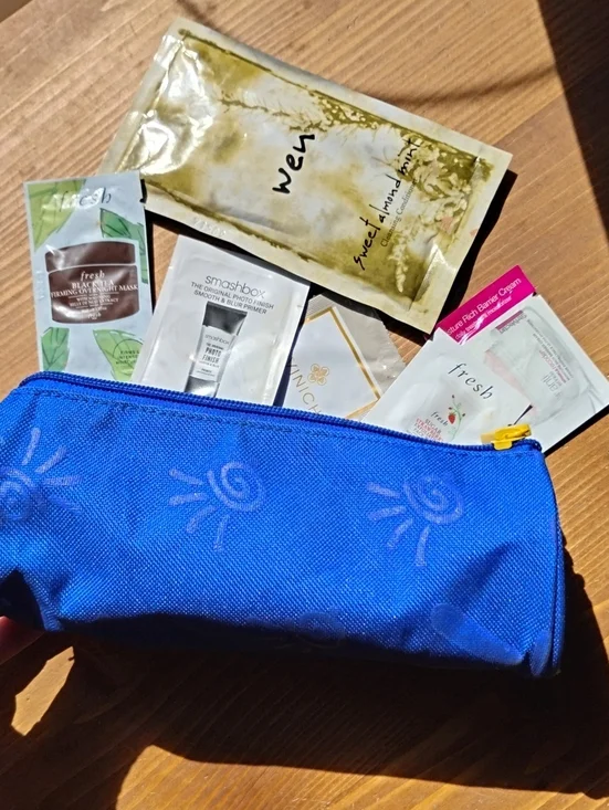 POUCH AND SAMPLE BUNDLE!! FUN! QUALITY SAMPLBlue Cosmetic Pouch with Sun Designs