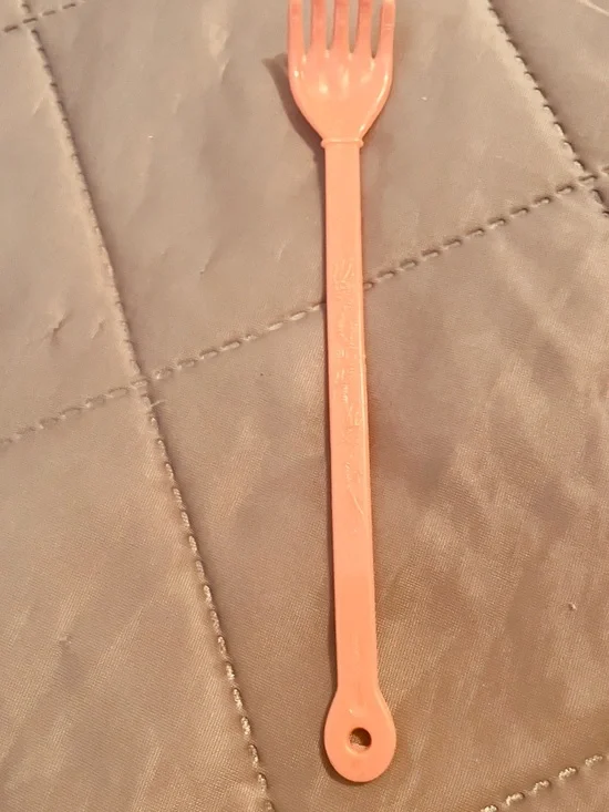 Long Peach Plastic Fork Spoon Utensil. Head Scratcher.