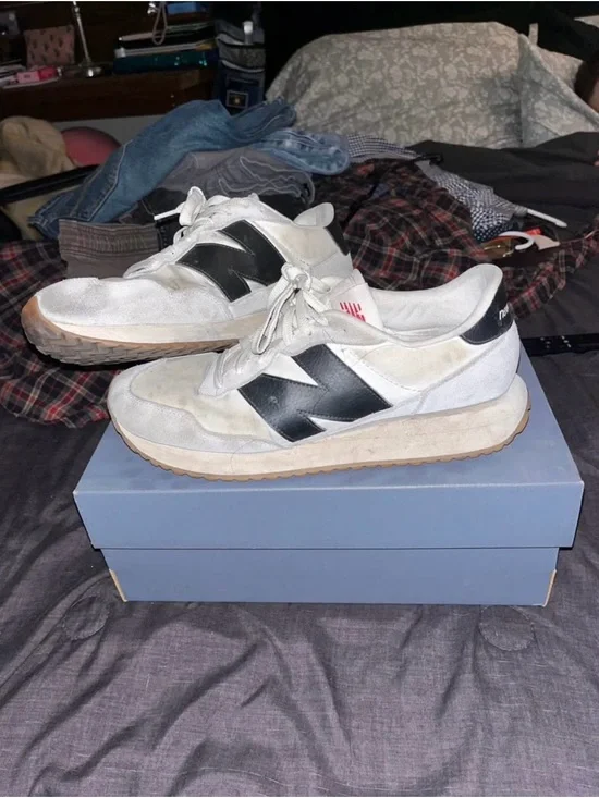 New Balance White Sneakers with Black Logo Accent