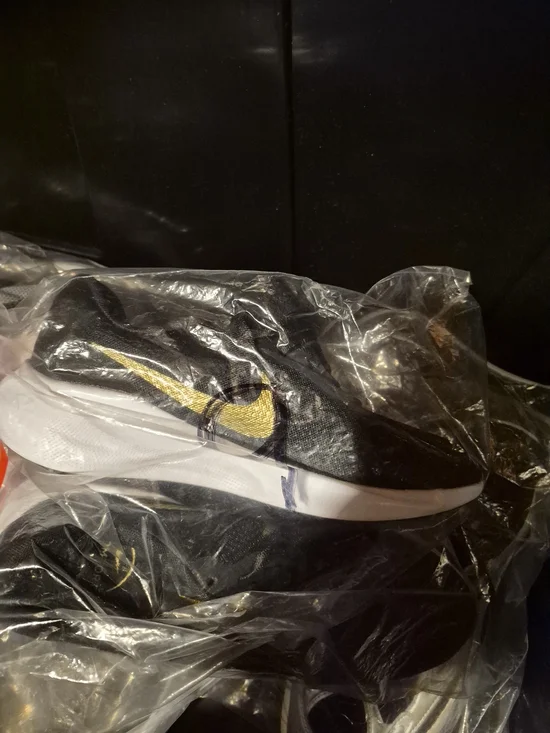 Nike Black Slip-On Sneakers with Gold Swoosh
