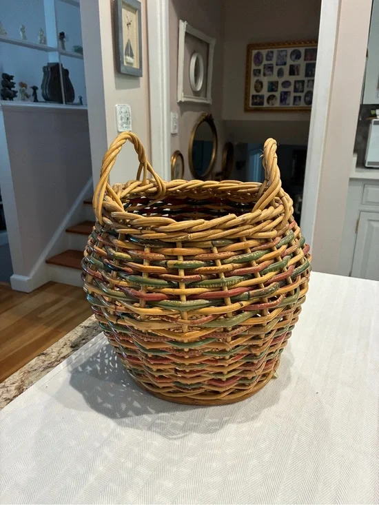 Vintage woven rattan willow gathering basket with a gently curve bulbous shape