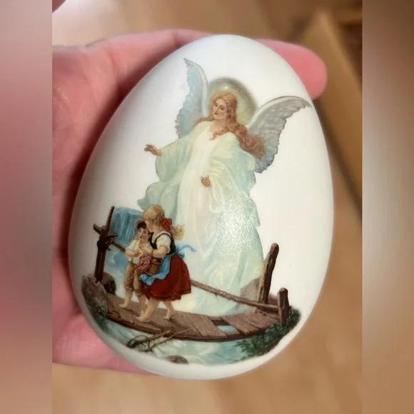 vintage porcelain egg with painting of guardian angel watching over children