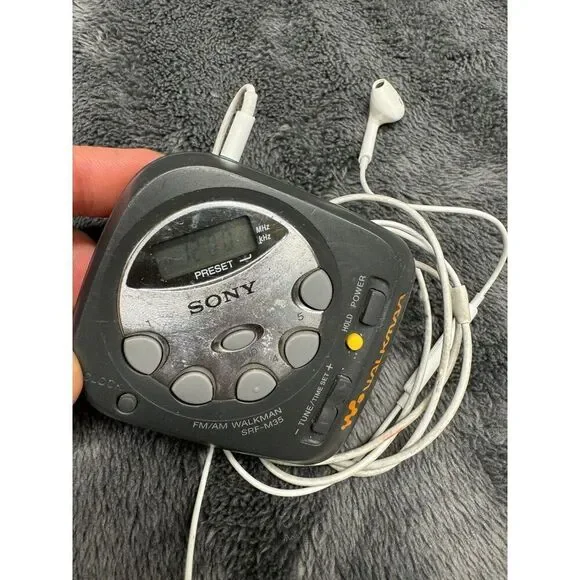 Vintage Compact Sony Am/FM Walkman with Apple Earpods w/Mic. Works great!  Runs