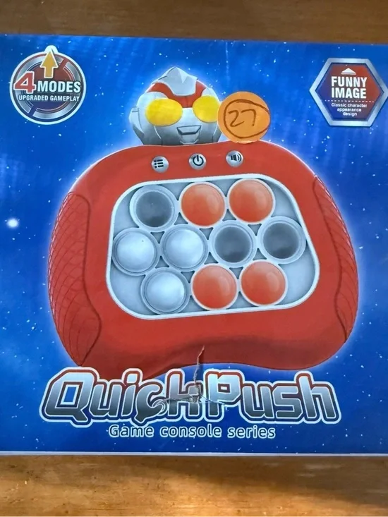 Red Handheld Game Console - Compact Pop-Button Gameplay