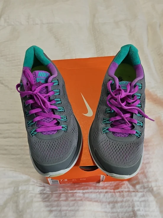 Nike Women’s Gray Athletic Shoes with Purple and Teal Accents