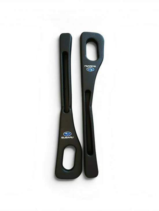 Subaru branded in black plastic inserts are designed as car seat gap fillers. NW