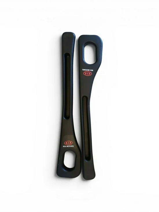 Kia branded in black plastic inserts are designed as car seat gap fillers. New