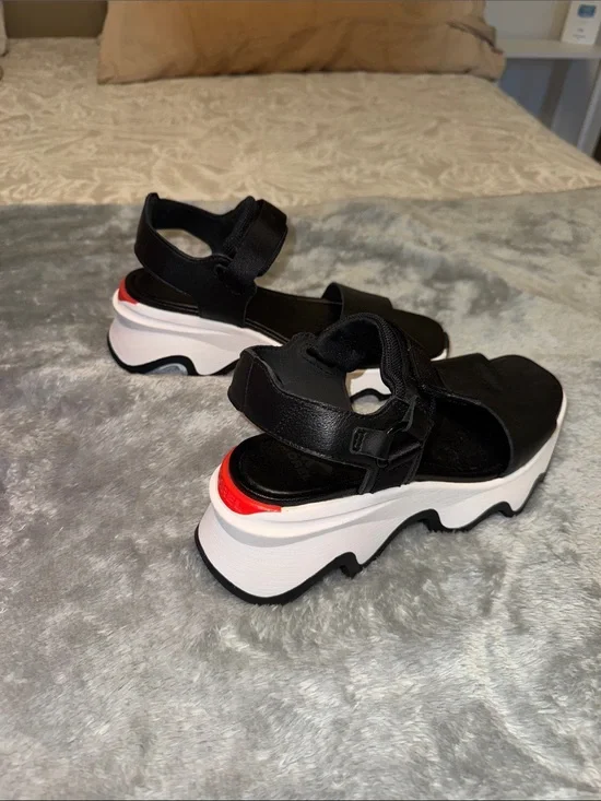 Sorel Black Platform Sandals with White Sole and Red Accent