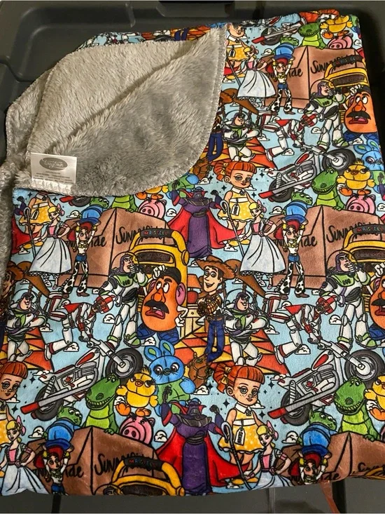 Plush Kids Blanket in Multi-Color Toy Character Print with Gray Sherpa Backing