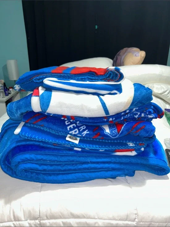5 Assorted New York Ranger blankets.
