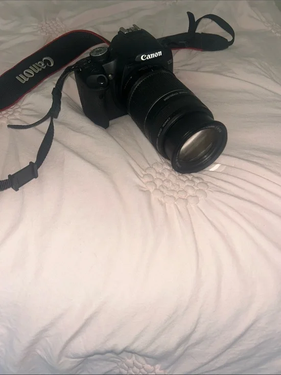 Canon Black DSLR with Zoom Lens and Branded Strap
