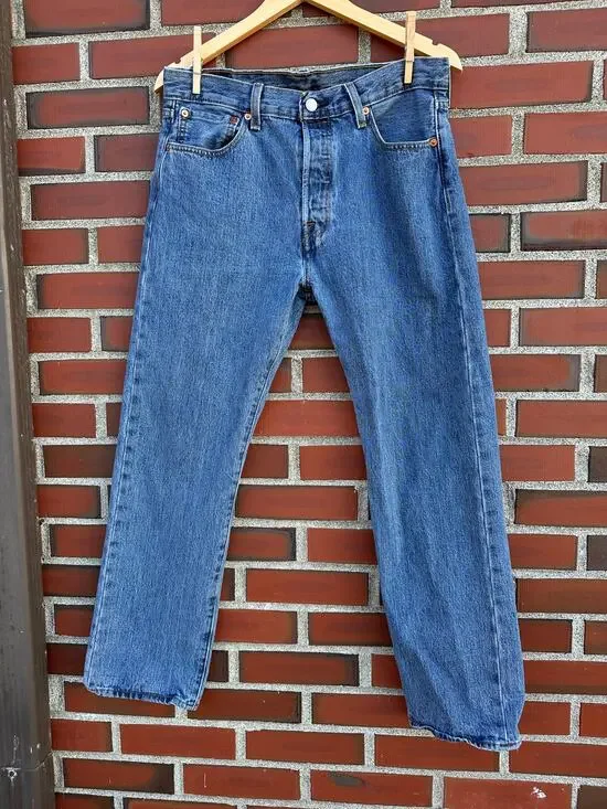 Vintage Levi's 501 button-fly jeans with Y2K's red batwing label