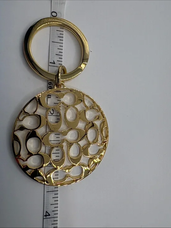Coach Gold Logo Cutout Circle Keychain