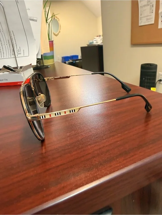 Burberry Gold Frame Sunglasses with Black and Red Stripe Accents