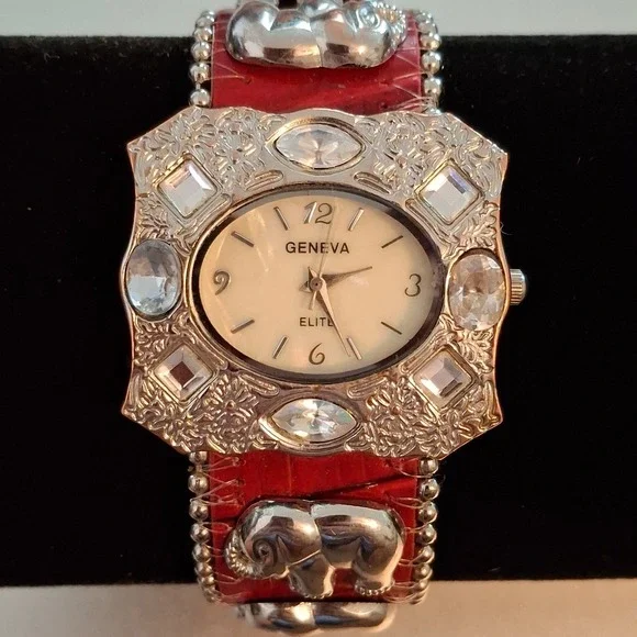 Geneva 92643 Womens Buckle Watch. Red Band, Silvertone,Elephant & Gem Accents.