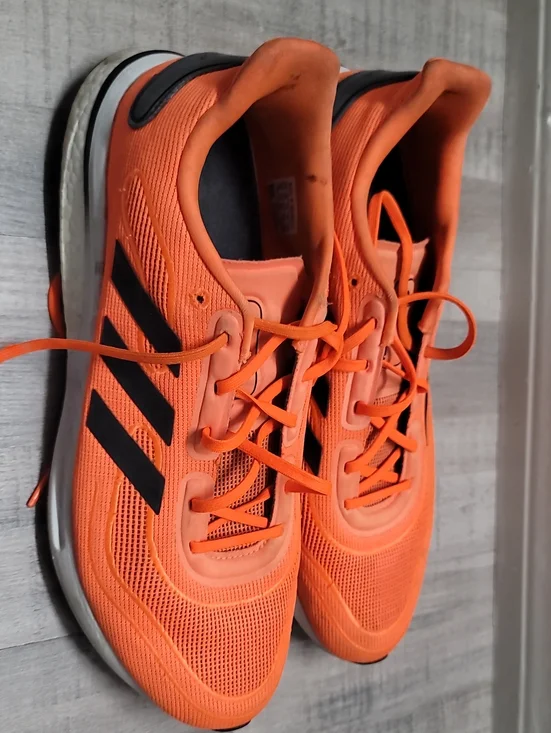 adidas Men’s Bright Orange Athletic Sneakers with Black Stripes