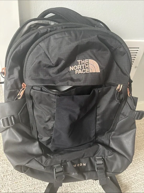 The North Face Black Backpack with Rose-Gold Accents