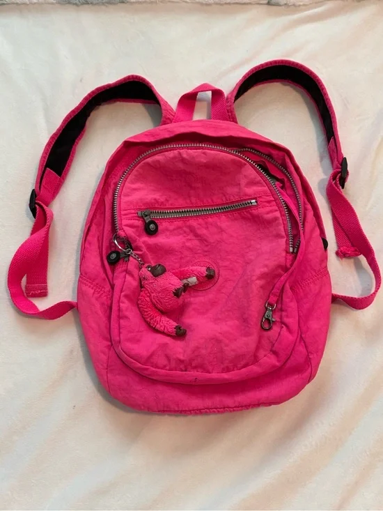 Vibrant Pink Kipling Backpack with Monkey Charm